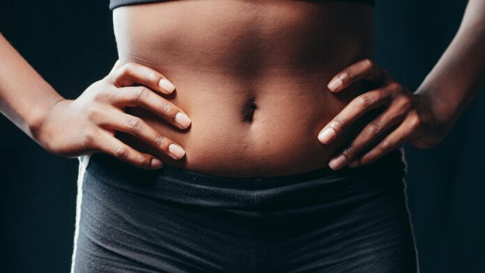 pexels-photo-7298900 a person touching her belly